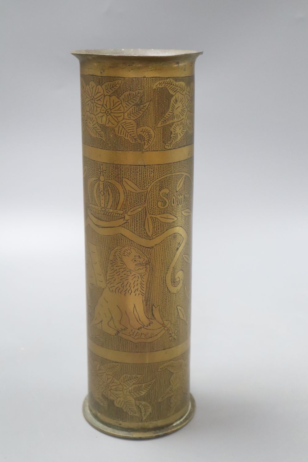 An early 20th century Trench Art vase reads Somme 1916 and Ypres 1914, height 27.5cm